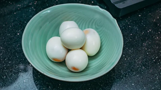 Boiled eggs in a green bowl