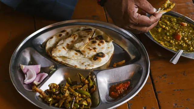 An everyday steel thali with roti, sabzi and chana